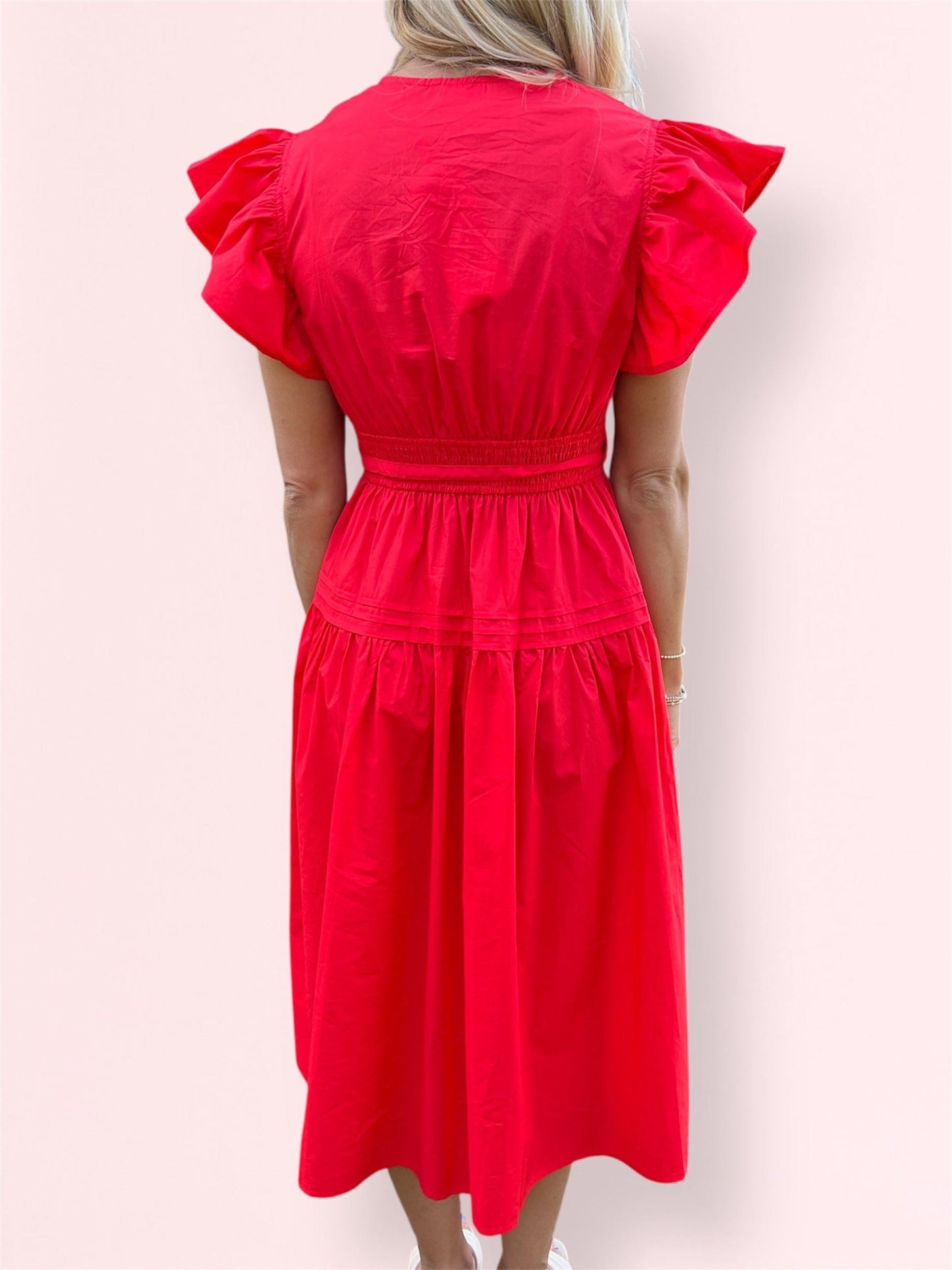 Back view of the Cala Midi Dress showing the smocked panel and flowy silhouette