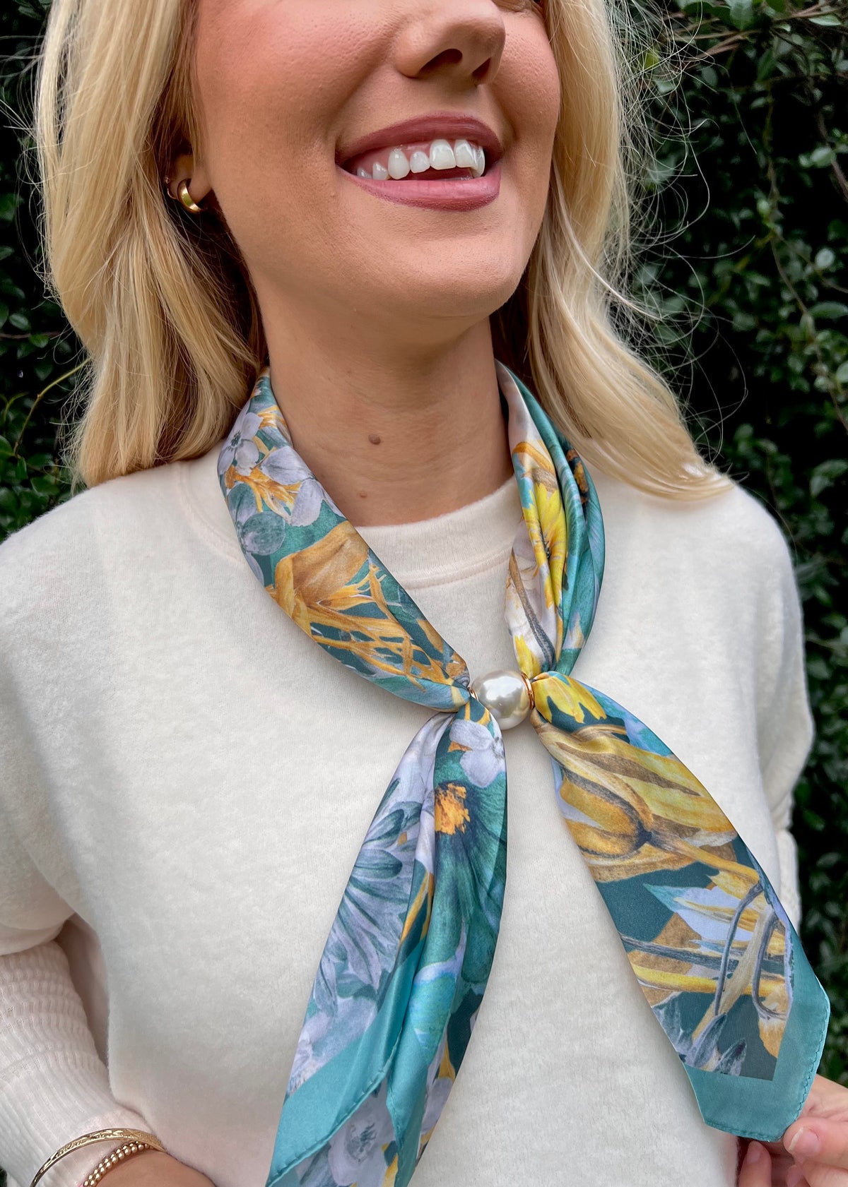 Close-up of Golden Garden floral scarf with pearl magnetic closure