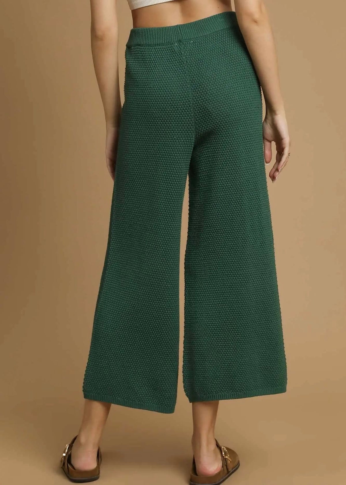 Back view of forest green textured wide leg pants