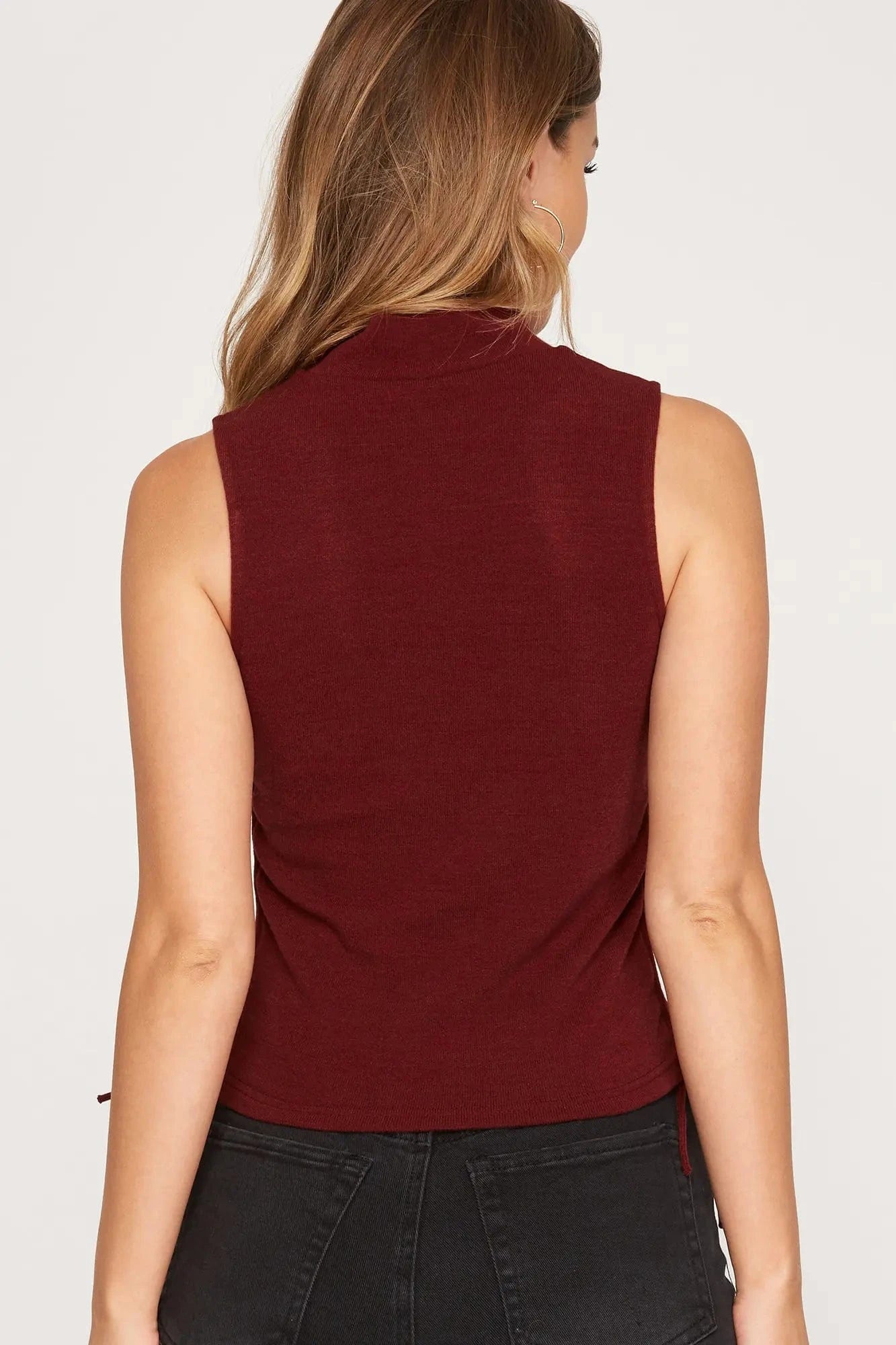 Back view of sleeveless knit mock neck top in chestnut