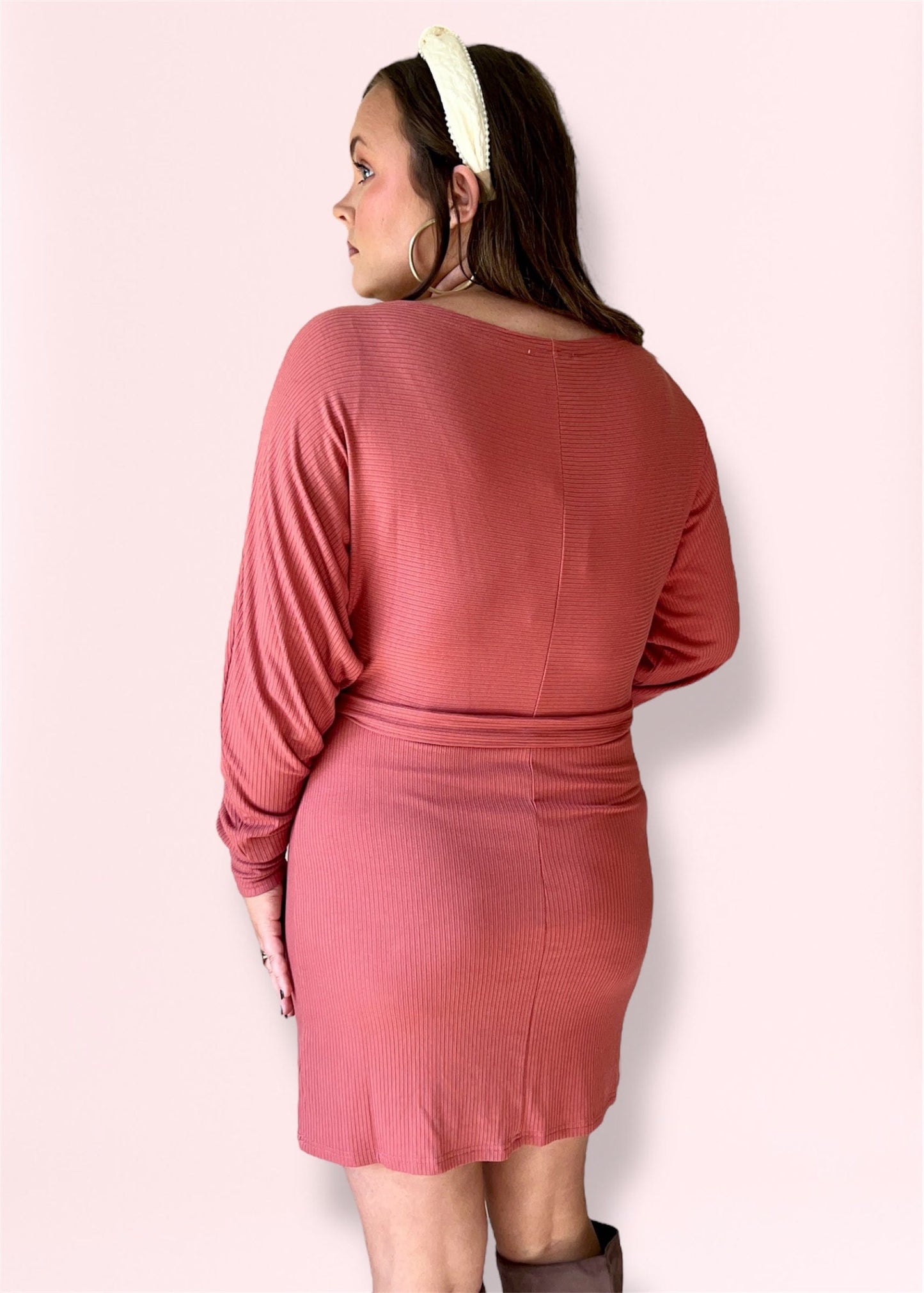 Back view of ribbed mauve knit dress with soft knit texture