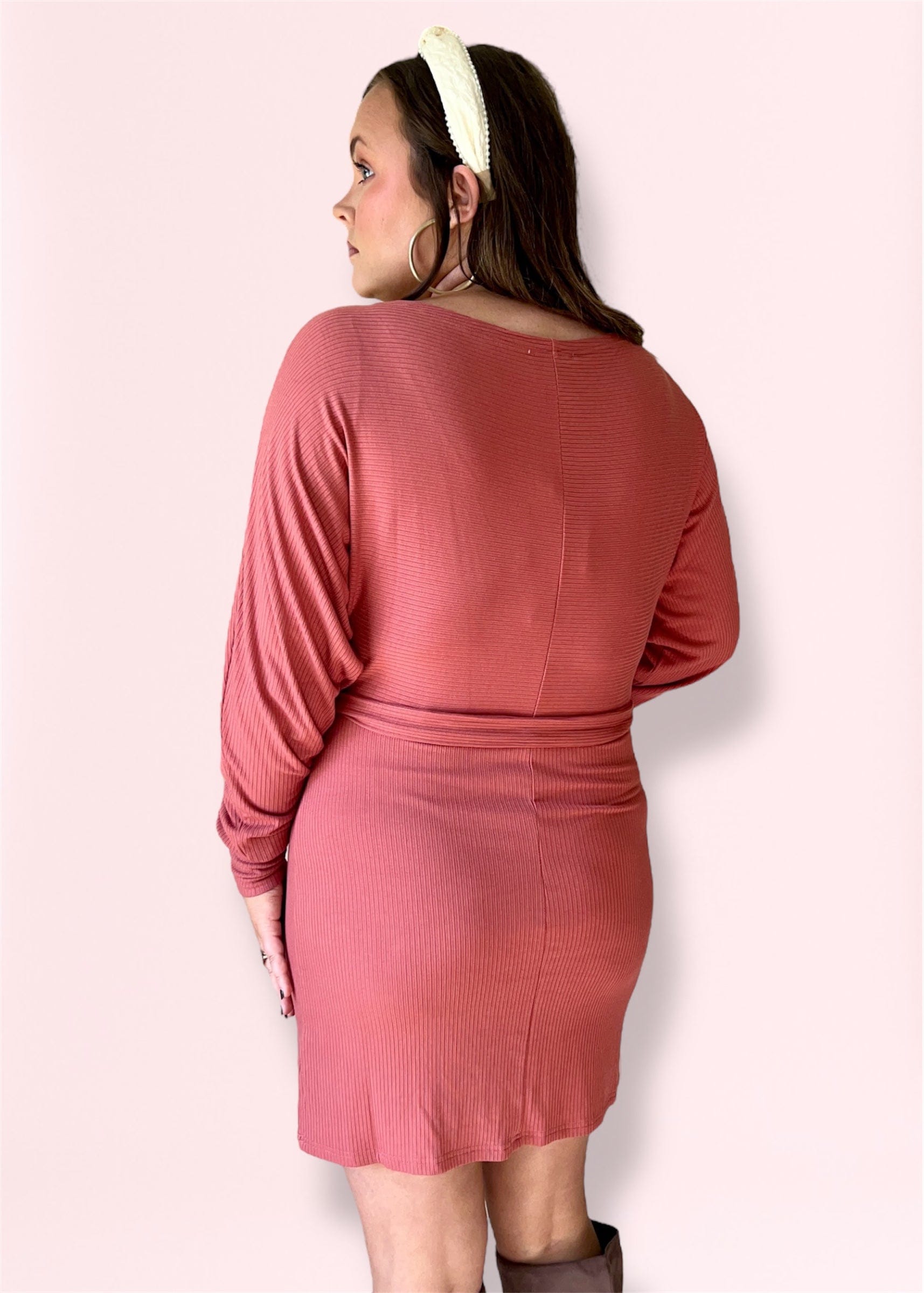 Back view of ribbed mauve knit dress with soft knit texture