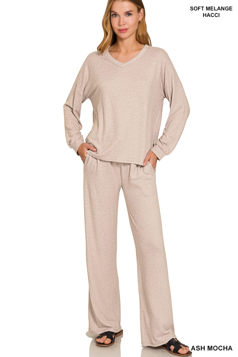 Woman wearing Ash Mocha two piece lounge set with V-neck top and wide-leg pants