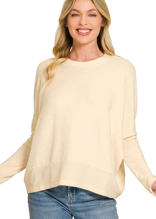 Women's cream oversized crew neck sweater with relaxed fit and ribbed hem