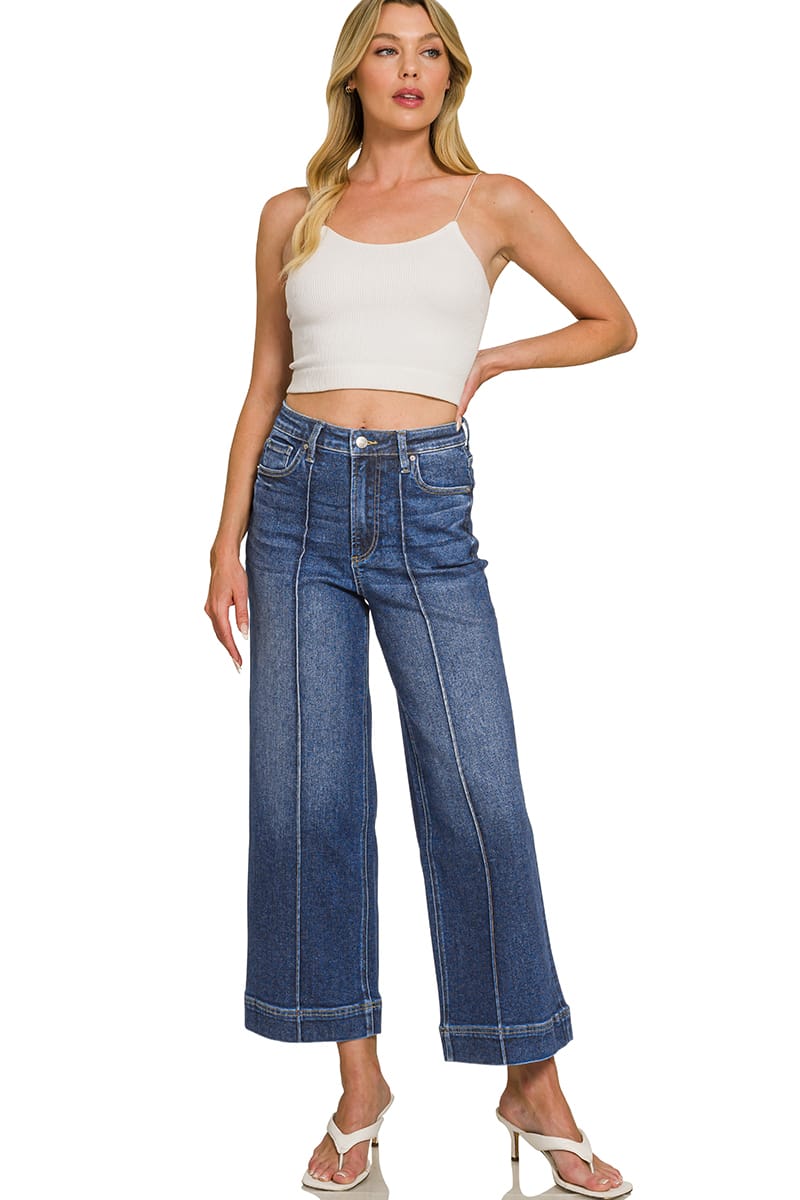 Model wearing women’s dark wash high rise cropped wide leg jeans